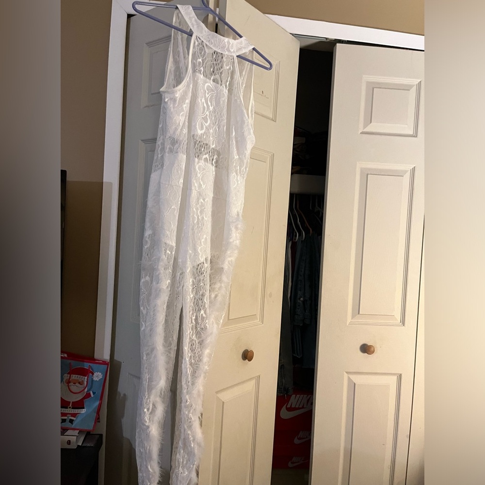 One piece white bodysuit. Never worn.